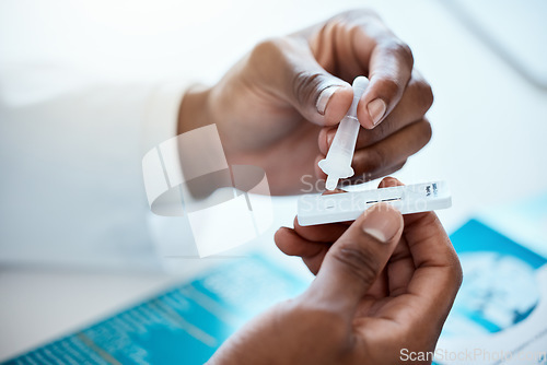 Image of Hands, covid and doctor with antigen test in hospital for healthcare, wellness and rapid viral testing. Pcr, covid 19 and black male physician with medical kit for examination, diagnosis or results.