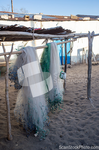 Image of Traditional fisherman's net hangs in the warm sunshine on the beach of Anakao village in Madagascar
