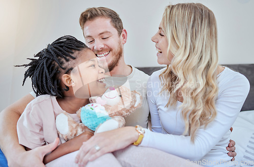 Image of Happy family, parents and adoption kid in bedroom, family home and house for fun, bonding and quality time with love, care and happiness together. Black kid relax with foster mom, dad and diversity