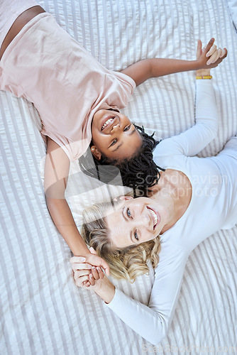 Image of Diversity, love and family together in bedroom for quality time or adoption care, support and happiness. Happy family, diverse mother and daughter portrait on bed for relax, calm and funny bonding