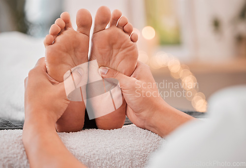 Image of Spa, feet and massage for relax, wellness and health on bed with hands, luxury and physical therapy. Professional, foot rub and service for healthcare, foot massage and healthy body care treatment