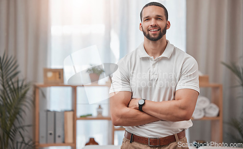 Image of Physiotherapist, spa and chiropractor man employee portrait ready for physiotherapy and consultation. Happy physical therapy and support worker feeling proud from health therapy clinic success