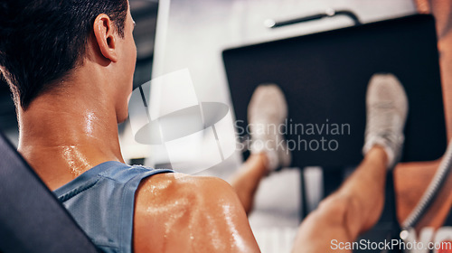 Image of Fitness, man sweating using leg press for workout, health and wellness, strong muscle and cardio in gym. Exercise motivation, body and weight training with sports and active, healthy lifestyle.