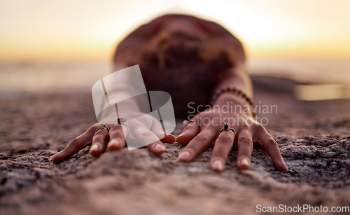 Image of Yoga, pilates and beach hands with zen of a woman on ocean sand for chakra and wellness meditation. Training, exercise and spiritual mindset of a athlete at sunset and nature in Miami stretching