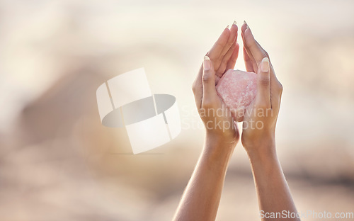 Image of Woman, crystal hands and zen outdoor in nature for healing wellness, mindfulness or peace with spirit rock. Rose quartz, energy stone or calm spiritual meditation for growth, health or relax for girl