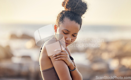 Image of Fitness, black woman and arm pain from sports injury, exercise or training workout accident in the outdoors. African American female suffering from sore shoulder muscle, inflammation or tension