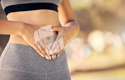 Image of Weightloss, hands and heart shape on stomach for body positivity during diet, exercise and training. Wellness, health and closeup of woman with self love gesture on tummy while doing outdoor workout.