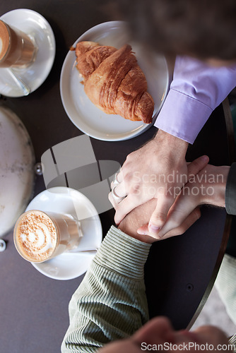 Image of Couple, hands and food at restuarant for quality time or relationship bonding together. Love, relax and support holding hands or talking at cafe dinning table for lunch, dinner or trust conversation