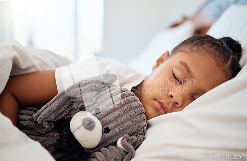 Image of Peace, morning and wellness of black child sleeping in cozy bed with toy teddy in home on the weekend. Relax, sleep and health of kid dreaming in comfortable home bedroom with teddy bear.
