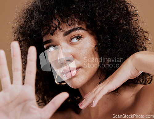 Image of Black woman, skincare and wellness with facial, wellness and skin health treatment glow. Woman model hands with fashion pose after collagen, botox and cosmetic face beauty with natural benefits