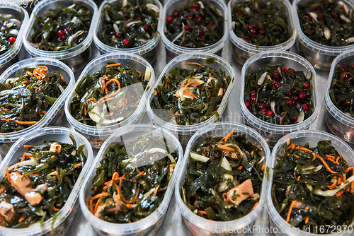 Image of Different fish and chuka wakame laminaria seaweed salad