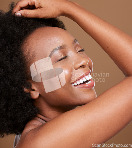 Image of Black woman, face and smile for skincare cosmetics, makeup of luxury treatment against brown studio background. African American female relax smiling in satisfaction for facial care and perfect skin