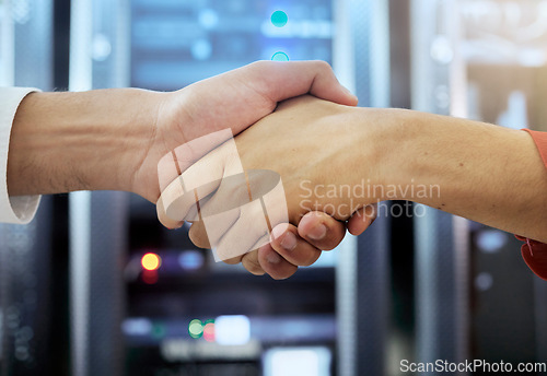 Image of Handshake, partnership and teamwork of server room of data center workers shaking hands for achievement, b2b deal and agreement. Man in woman together in collaboration for network, IT and support