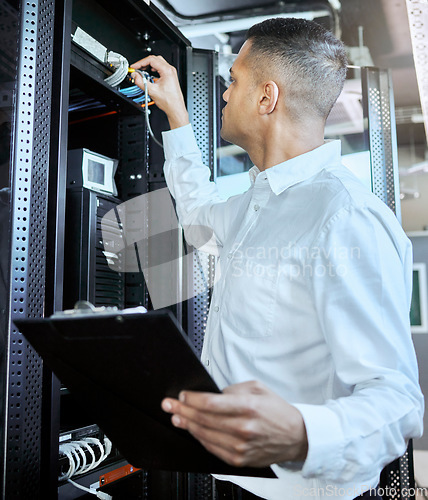 Image of Information technology, server and man engineer with clipboard working, fixing and checking motherboard. Programming, cyber network and IT technician with wires in data center for 404 glitch or error