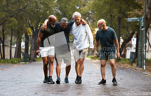 Image of Mature, friends and fitness pain with men helping friend after injury while training in nature for wellness and health. Exercise, workout and man with leg injury being helped by group working out