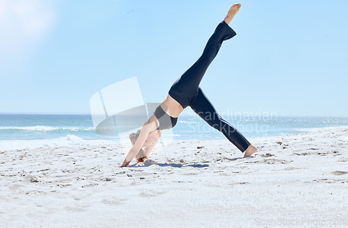 Image of Beach, yoga and woman pilates with balance, workout wellness and meditation on sea sand. Athlete with fitness, exercise and zen pose stretching for peace, relax and sports training outdoor by ocean