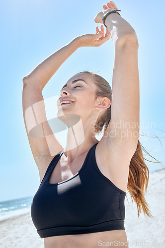 Image of Freedom, yoga and beach fitness of a woman stretching arms feeling zen, relax and peace outdoor. Sea meditation, exercise and wellness of an athlete after pilates with mindfulness and body balance