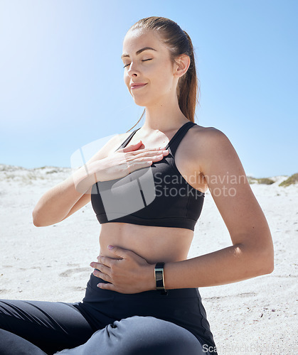 Image of Yoga, meditation and beach fitness of a woman athlete with a zen prayer and mindfulness in nature. Meditate, peace and wellness exercise by the ocean sand for chakra, workout and relax sea pilates