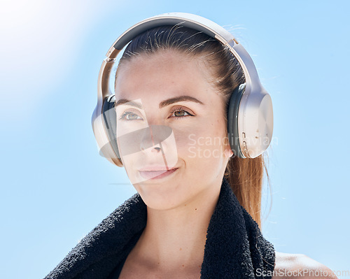 Image of Headphones, fitness and woman on an outdoor workout adventure for health while listening to music. Sports, wellness and girl from Australia streaming audio, radio or podcast for exercise motivation.