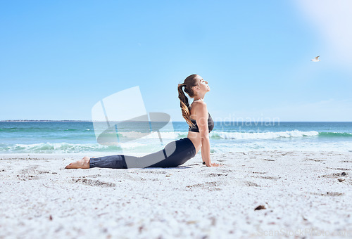 Image of Zen yoga, woman and stretching on beach for healthy, relax or meditation. Fitness balance exercise, chakra training and pilates mindset for wellness freedom on ocean sand with nature, calm or workout