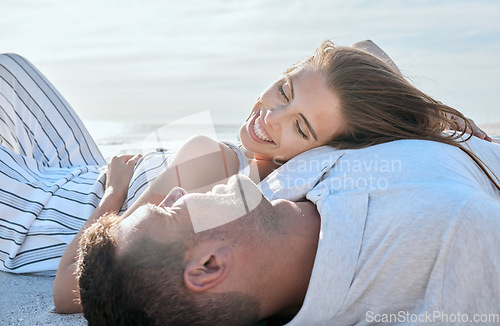 Image of Happy couple relax on beach, woman with smile and summer love in Portugal sunshine on holiday together. Marriage happiness, seaside date in outdoor ocean vacation and girlfriend laying on mans chest