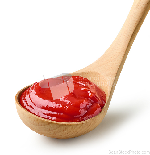 Image of tomato sauce in wooden ladle