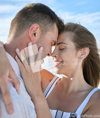 Image of Couple, hug and forehead with smile for love, care or relationship bonding together in the outdoors. Happy man and woman touching heads and hugging for loving romance or embrace in satisfaction