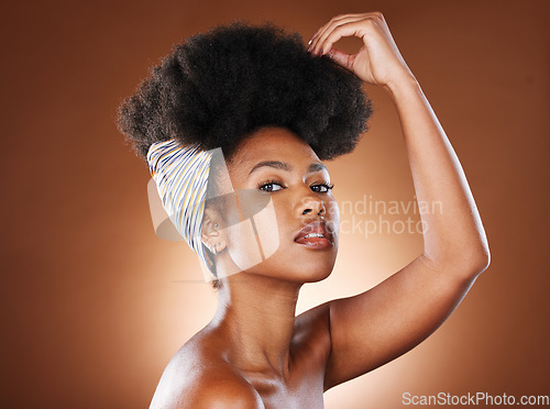 Image of Black woman, afro hair and scarf for fashion, studio and beauty, clothes and culture of Nigeria heritage. Portrait of african girl model, natural curly hairstyle and head wrap for beauty of hair care