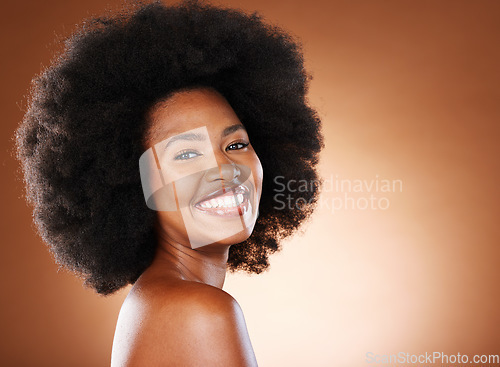 Image of Portrait of black woman, beauty and hair care model with cosmetics hairstyle, afro empowerment and happy Nigeria model. Face of happy, proud African girl and healthy skincare glow in a studio