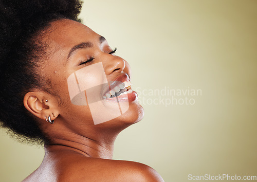 Image of Beauty, skincare and black woman with a smile in a studio with a natural face routine with mockup space. Happy, cosmetics and African model with a facial treatment isolated by a green background.