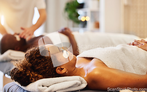 Image of Wellness, facial and massage for couple in spa for relaxation, stress relief and wellbeing. Beauty, skincare and black couple in luxury beauty salon with cosmetic eye mask on for romantic holiday