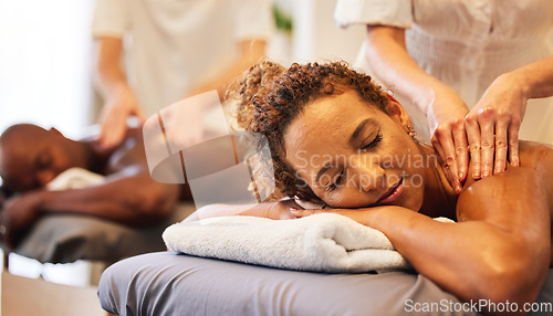 Image of Black couple massage, spa and relax together on vacation, holiday or retreat for bonding, honeymoon or calm. Black woman, man or couple together for masssage therapy service, health and wellness