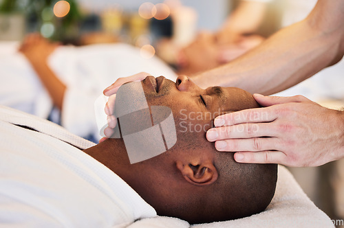 Image of Massage, sleeping and face of a black man at a spa for peace, relax and luxury service with the hands of a worker. Wellness, skincare and African person at a salon for stress relief with a masseuse