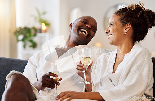 Image of Love, couple and wine at hotel on vacation, holiday or honeymoon trip. Romance, luxury champagne and interracial couple, man and woman drinking alcohol, talking and enjoying quality time together.