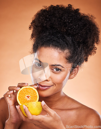 Image of Lemon, skincare and black woman with food to detox against a brown studio background. Marketing, vitamin c and portrait of an African model advertising fruit for natural beauty, skin and nutrition