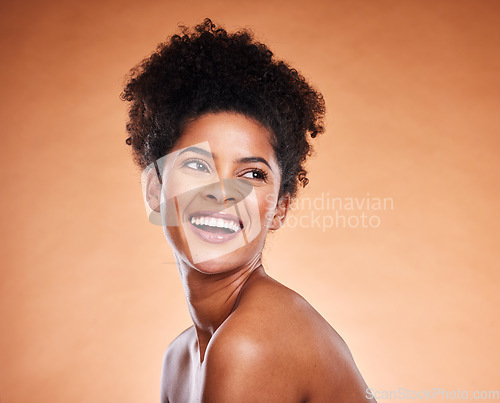 Image of Skincare, wellness and happy black woman in studio for cosmetic, natural and healthy face routine. Happiness, beauty and young African model with health facial or skin treatment by orange background.