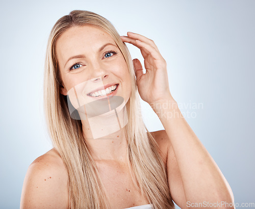 Image of Health, beauty and straight hair portrait of blonde model feeling smooth, soft and luxury texture. Shine, cosmetic and happy woman satisfied with salon hair care on gray studio mock up.