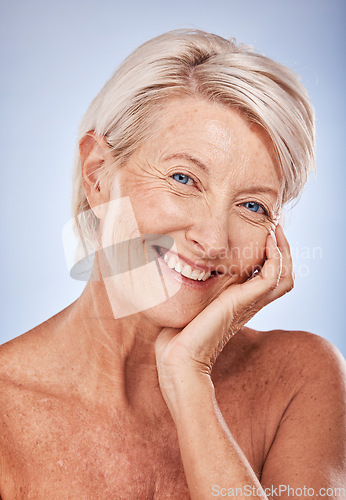 Image of Portrait, cosmetics and senior woman with natural beauty, skincare and wellness for health on blue studio background. Makeup, mature lady or elderly female with smile, face detox and smooth skin care