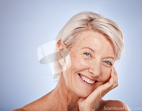 Image of Face, beauty and skincare with a senior woman in studio on a gray background for wellness or luxury. Portrait, cosmetics and antiaging with a mature female posing to promote a natural product