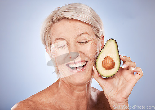 Image of Beauty, skincare and elderly woman with avocado cosmetics smile for organic skin health, natural detox and luxury spa mockup. Portrait of happy senior, wellness treatment and healthy diet in a studio