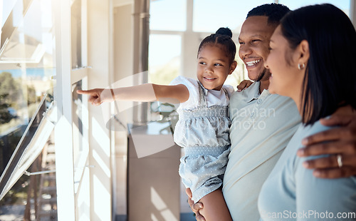 Image of Family, children and animal shelter with a mother, father and daughter at a rescue center for adoption. Love, charity and pointing with a man, woman and girl bonding as social or volunteer staff