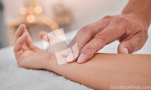 Image of Spa, wellness and hands massage wrist for health, relaxation and pressure relief service zoom. Acupressure, physical therapy and relaxing luxury treatment with professional beauty salon therapist.