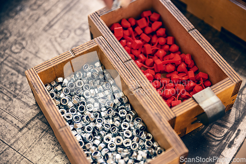 Image of Metal nut with metric thread in wooden box