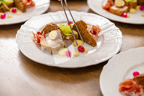 Image of Chef are arranging small pieces of food