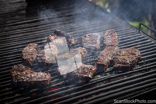 Image of Grilled beef steak on the grill