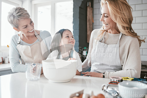 Image of .Child, grandmother and mom teaching cooking together in kitchen bonding, quality time or fun activity at home. Happy mother, grandma and excited kid chef learning to bake cake with family support.