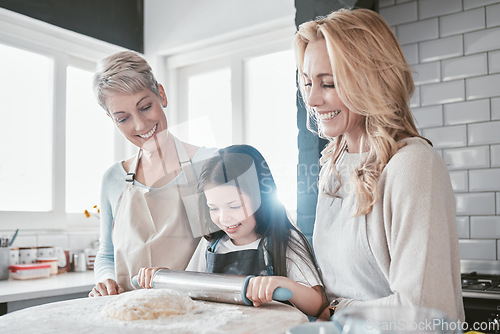 Image of Baking, bonding and child with mother and grandmother in the kitchen learning to bake in their house. Food, love and girl kid with a smile with mom and senior woman teaching to cook together