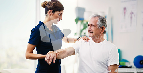 Image of Physiotherapy doctor, senior patient and stretching arm, physical therapy or orthopedic healthcare in clinic. Physiotherapist, chiropractor and nurse help old man with rehabilitation, muscle and body