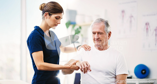 Image of Nurse, patient and physical therapy for elderly care, medical or healthcare support at the clinic. Woman physiotherapist or chiropractor helping mature man in physiotherapy or arm stretching