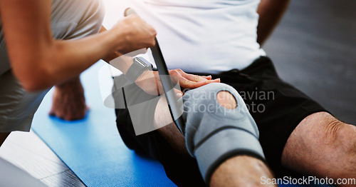 Image of Rehabilitation, woman therapist or knee brace in physiotherapy with senior man patient, knee pain or consulting expert. Physiotherapist, physical therapy and healthcare worker help, support or advice